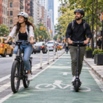 Electric bicycle and scooter riders traveling through a New York City bicycle lane